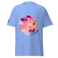Carolina Blue | Front view of the Lion of Judah women's faith T-shirt featuring a colorful pink and purple lion surrounded by flowers with a Messianic Merch sleeve logo.